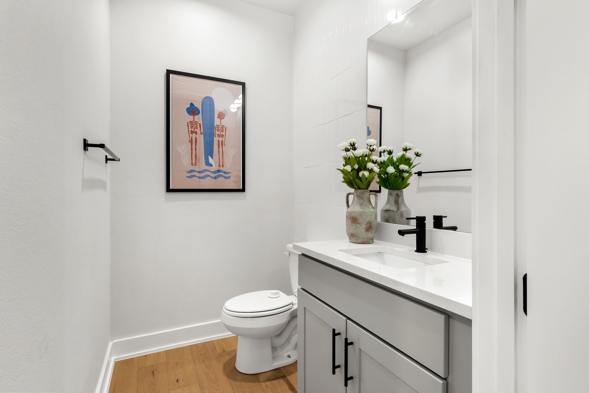 5109 Stone Gate Drive, Unit 1 Austin, TX 78721 - Photo 16 of 36 a bathroom with a toilet sink and mirror