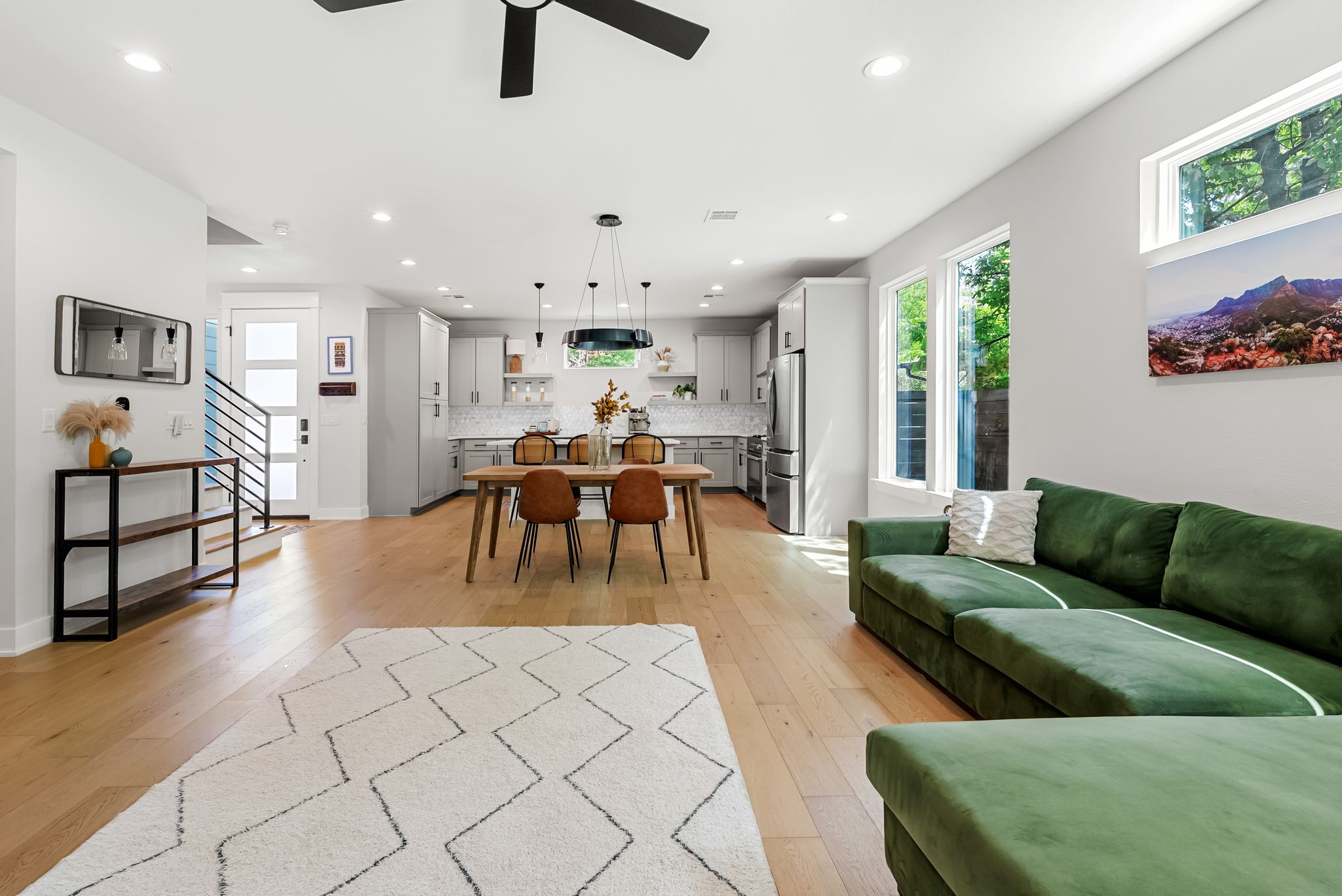 5109 Stone Gate Drive, Unit 1 Austin, TX 78721 - Photo 17 of 36 a living room with furniture and wooden floor