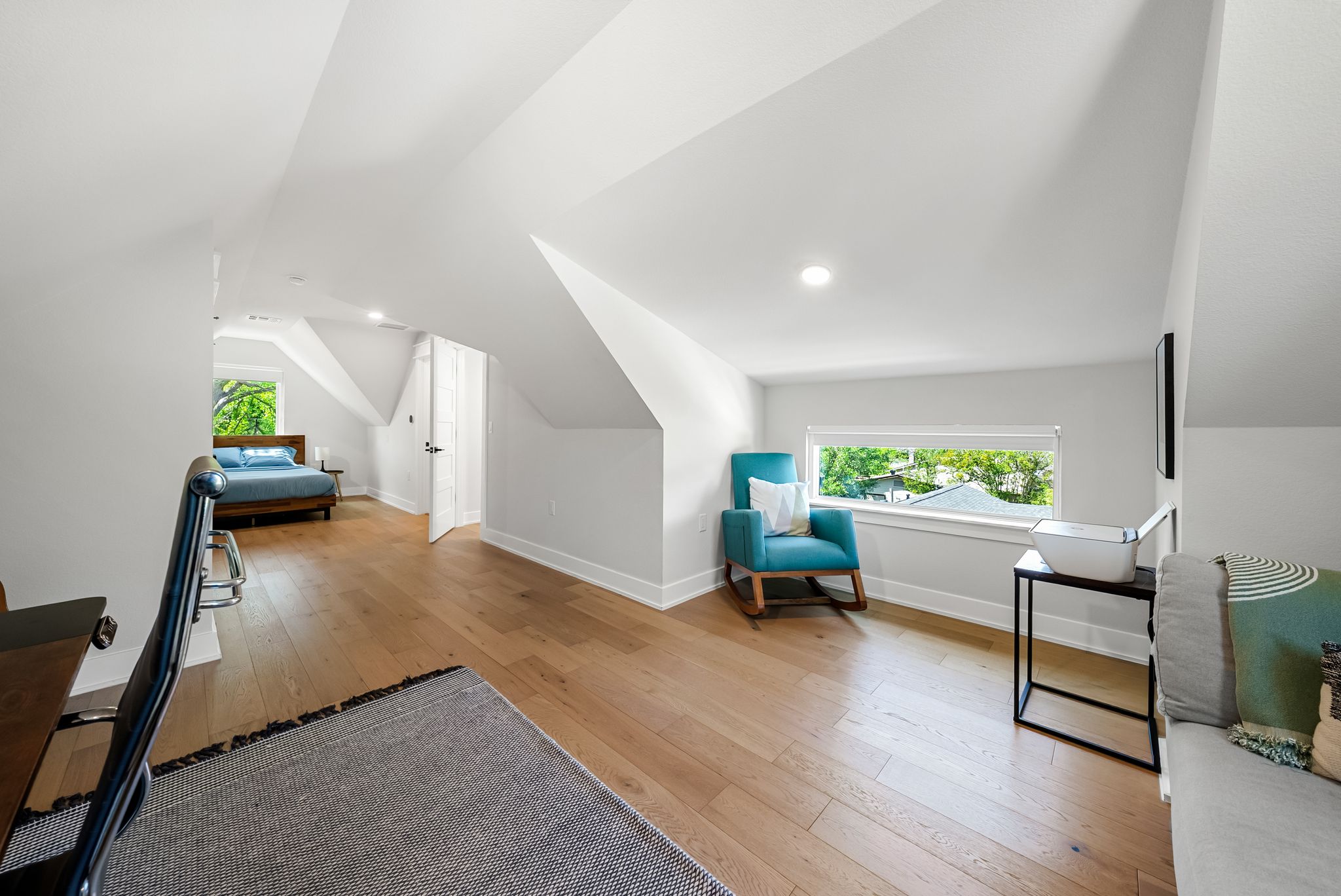 5109 Stone Gate Drive, Unit 1 Austin, TX 78721 - Photo 28 of 36 a living room with furniture and a wooden floor