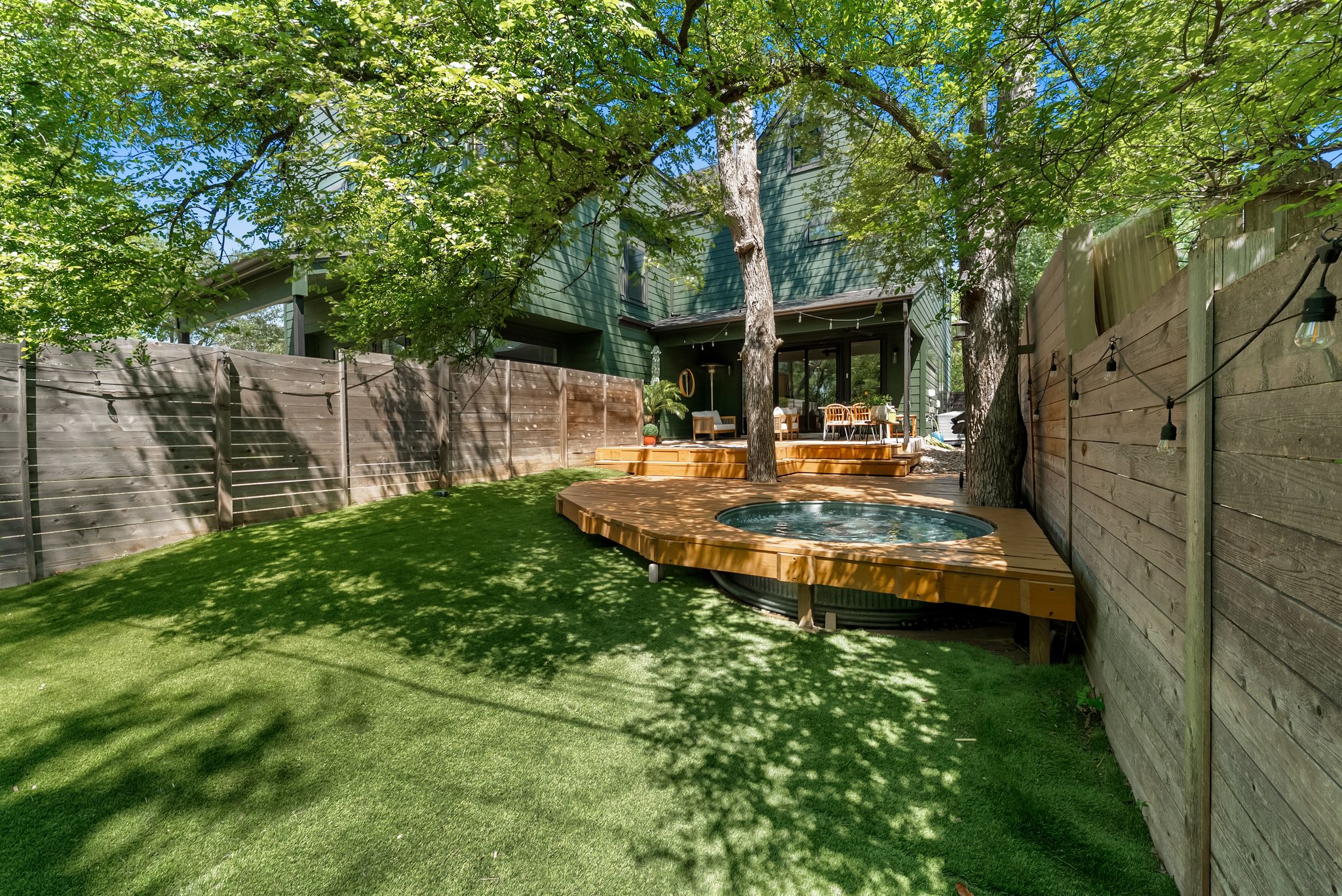 5109 Stone Gate Drive, Unit 1 Austin, TX 78721 - Photo 31 of 36 a view of a house with backyard and sitting area
