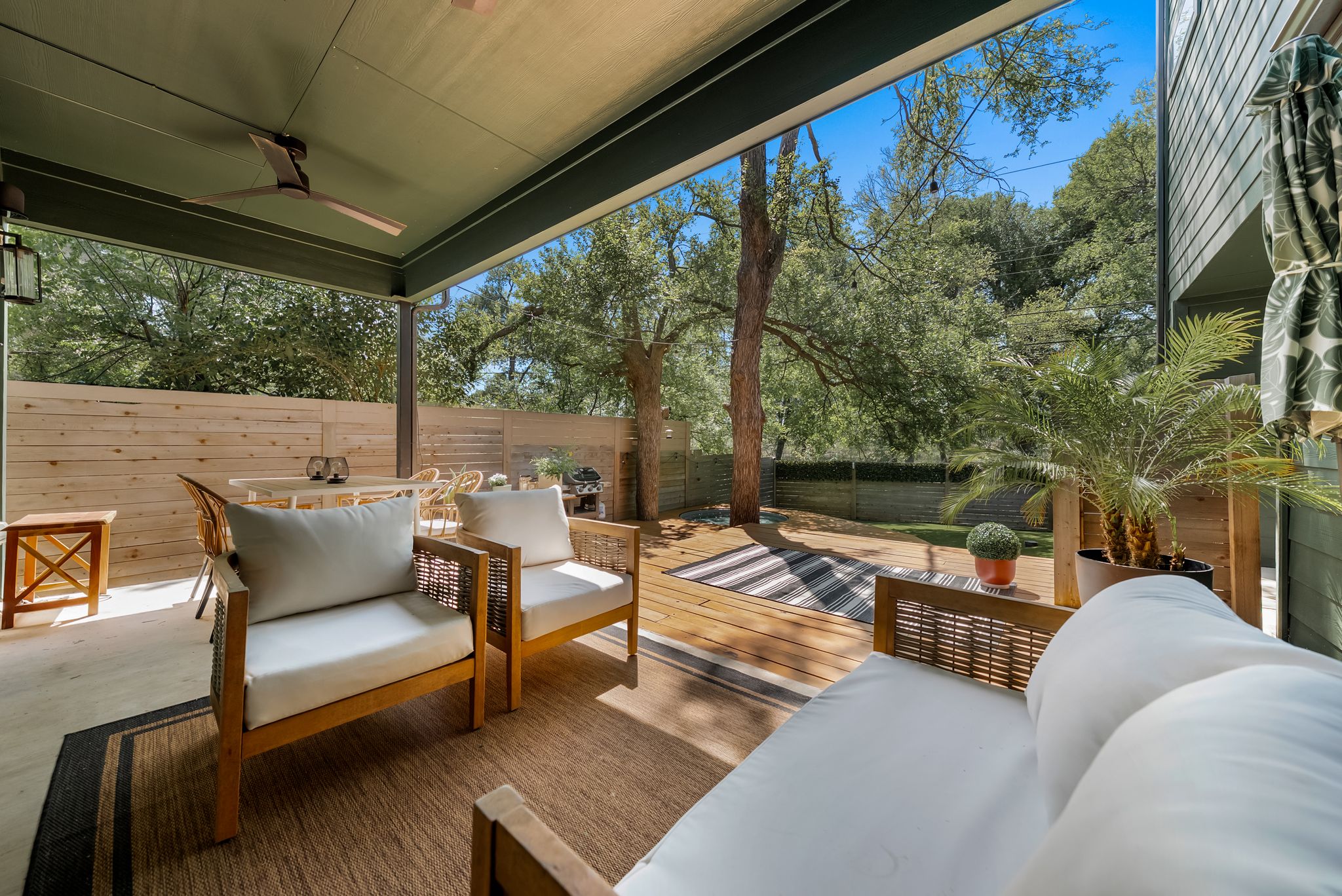 5109 Stone Gate Drive, Unit 1 Austin, TX 78721 - Photo 5 of 36 a balcony with furniture and a garden