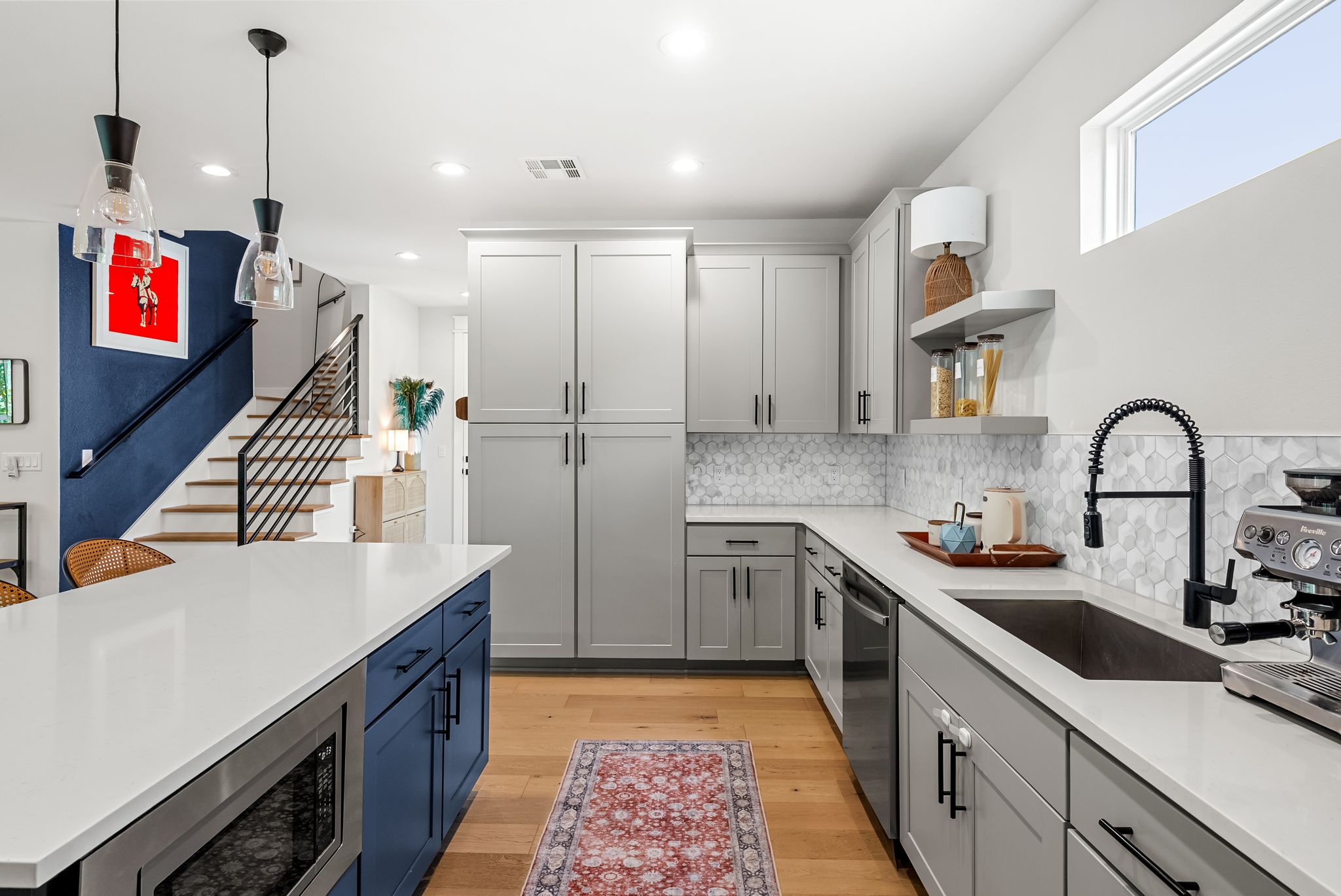 5109 Stone Gate Drive, Unit 1 Austin, TX 78721 - Photo 10 of 36 a kitchen with stainless steel appliances granite countertop a sink and cabinets