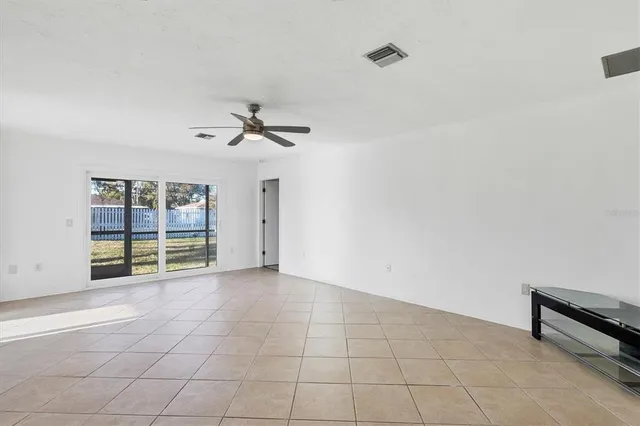 a view of an empty room with a window