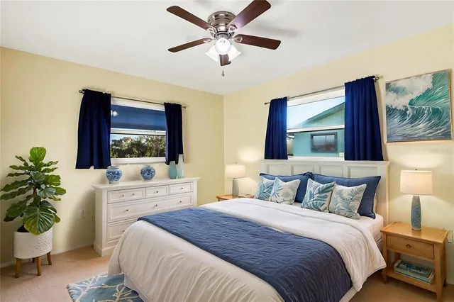 a bathroom with a granite countertop sink a toilet and a mirror