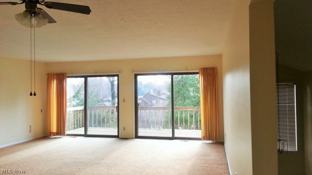3892 South Turkeyfoot Road Akron, OH 44319 - Photo 3 of 15 Family room sits off the kitchen and leads to the deck.