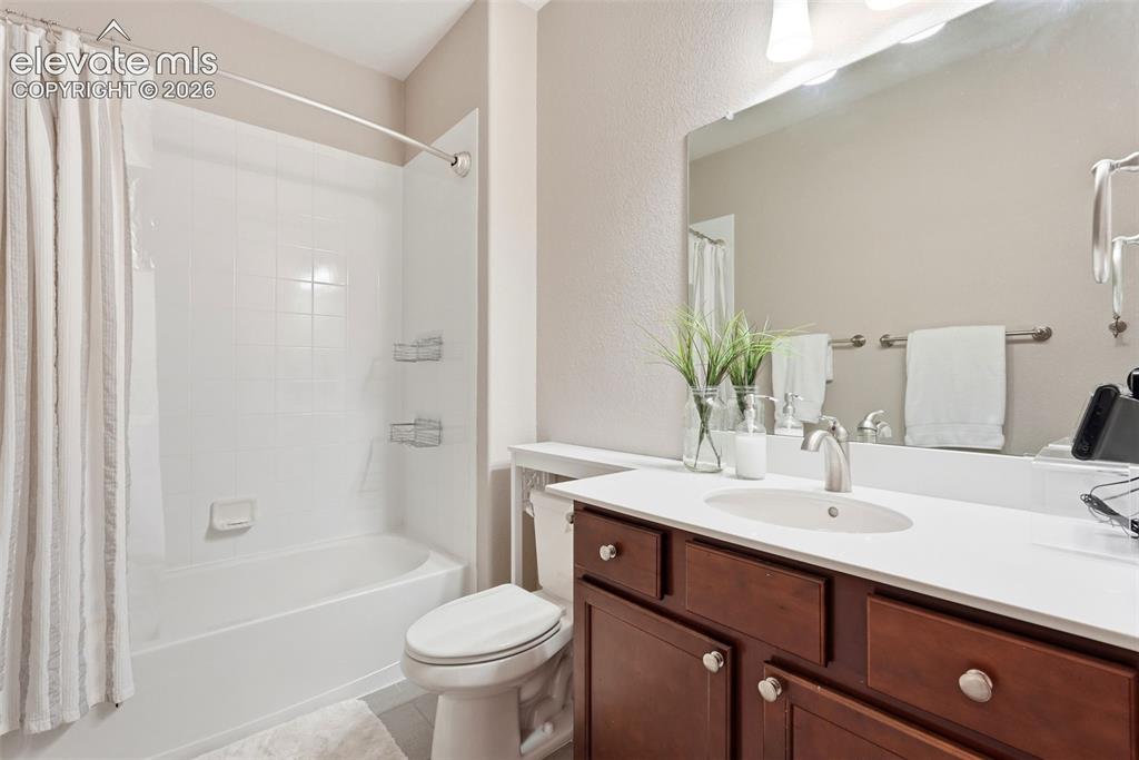 1394 Promontory Bluff View Colorado Springs, CO 80921 - Photo 44 of 47 a bathroom with a sink a toilet and shower