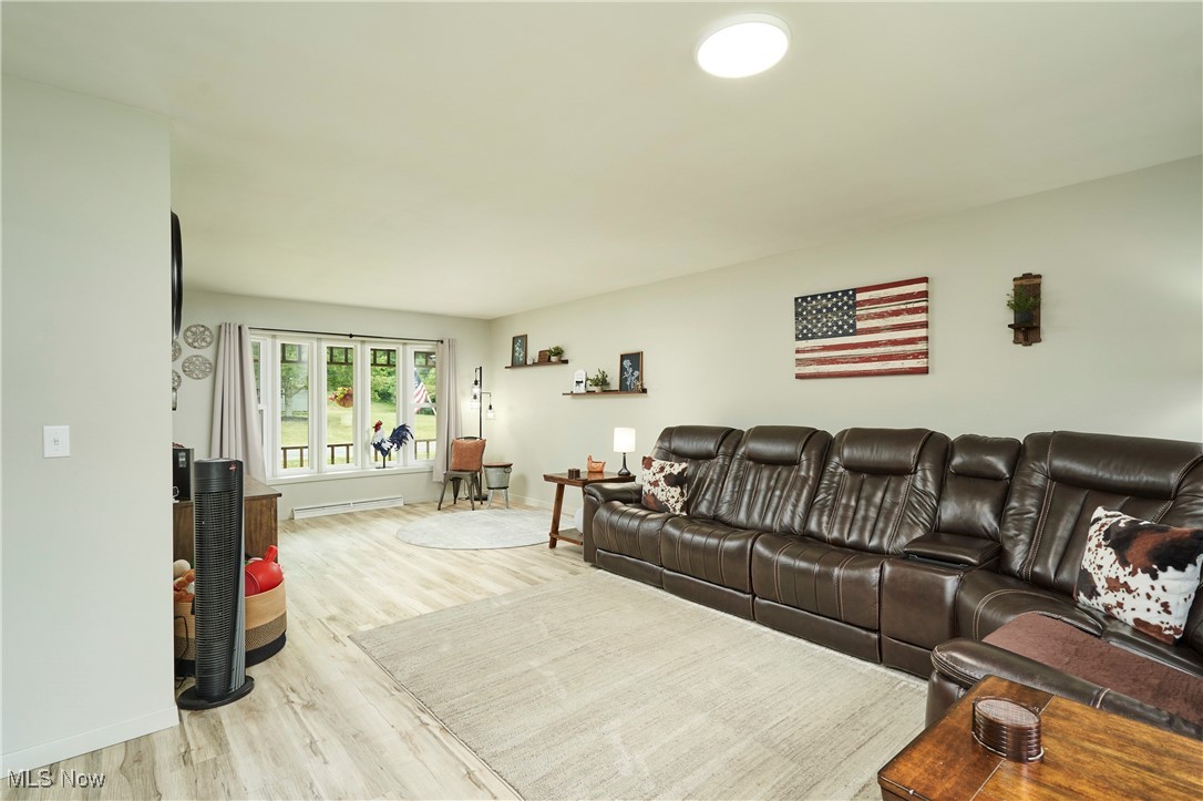 2835 Sunnybrook Road Mogadore, OH 44260 - Photo 3 of 27 Living area featuring wood finished floors and baseboards
