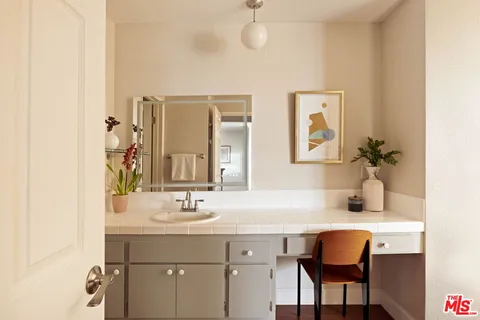 a bathroom with a sink and a mirror