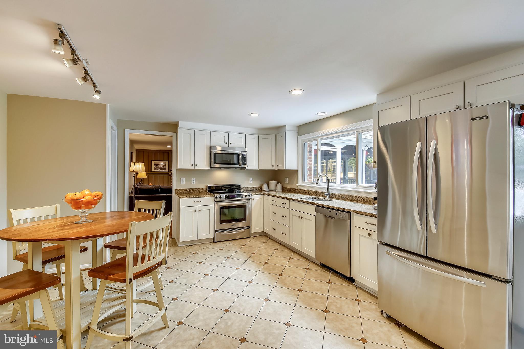 8801 Cold Spring Road Potomac, MD 20854 - Photo 11 of 44 a kitchen with stainless steel appliances a refrigerator sink and microwave