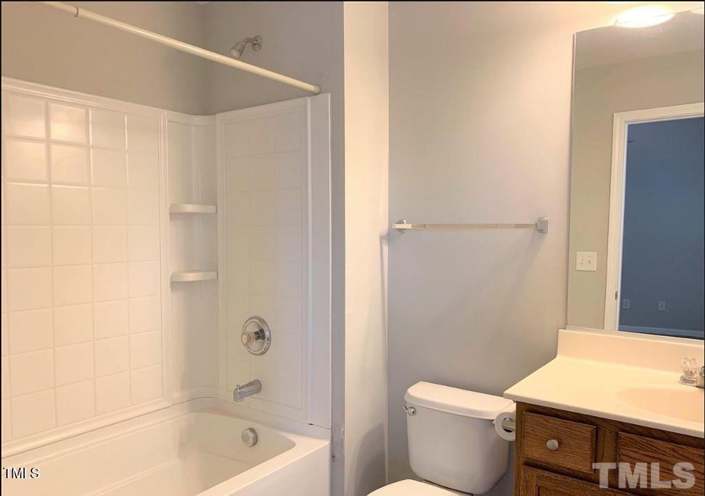 142 Forthview Way Apex, NC 27502 - Photo 6 of 11 a bathroom with a bathtub and a toilet