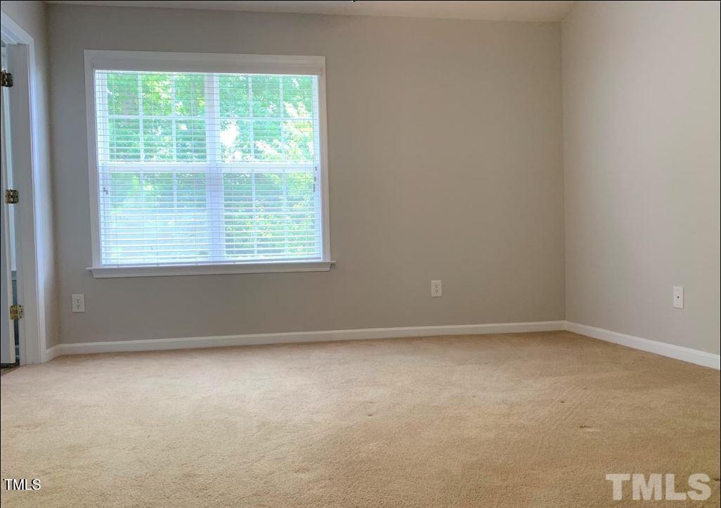 142 Forthview Way Apex, NC 27502 - Photo 7 of 11 an empty room with a window