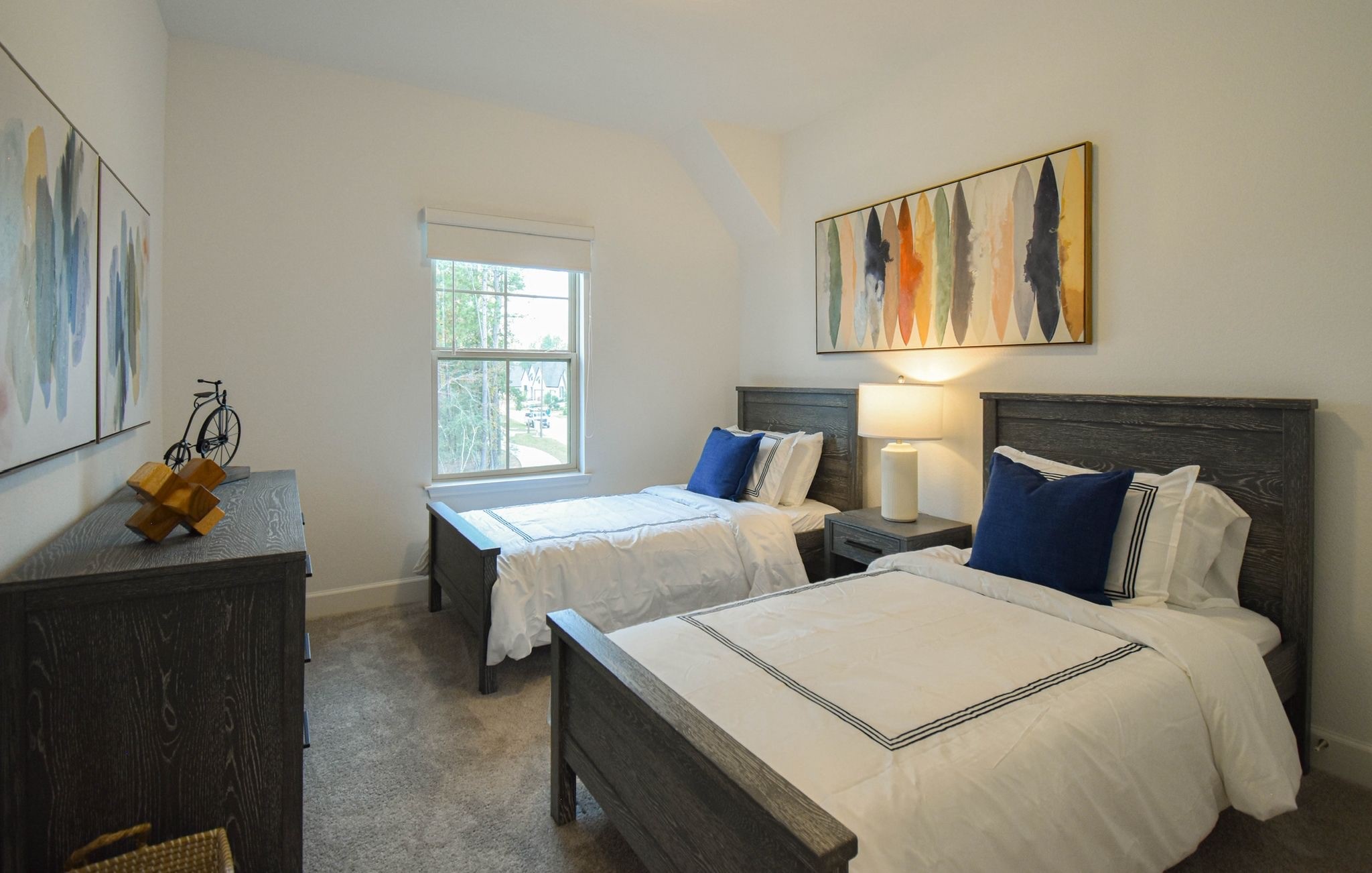 176 Sweeping Valley Drive Montgomery, TX 77316 - Photo 11 of 50 a bedroom with two beds and a window