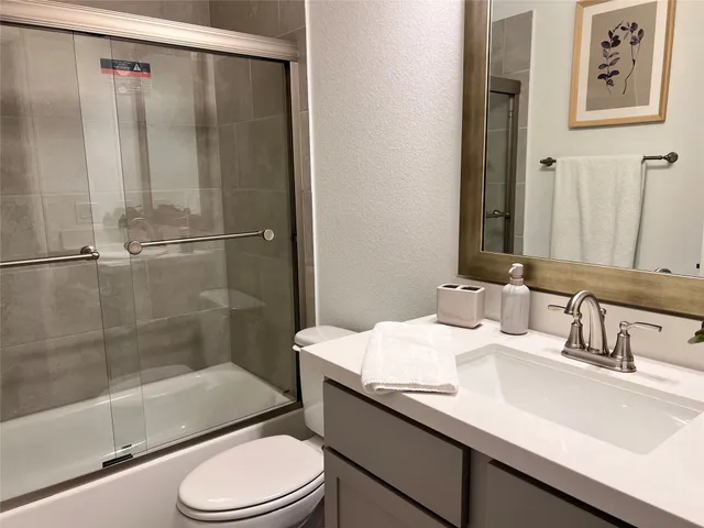 a view of a dining room with furniture and window