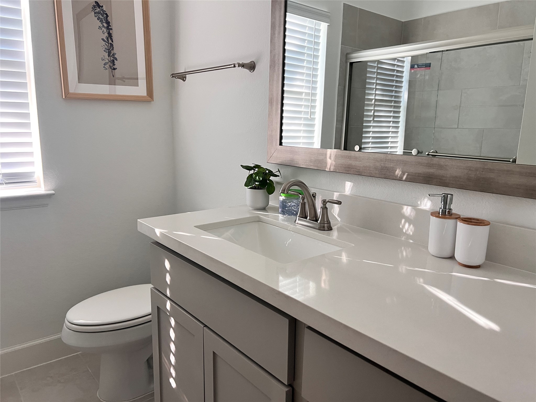 176 Sweeping Valley Drive Montgomery, TX 77316 - Photo 42 of 50 a bathroom with a granite countertop sink a toilet and a window