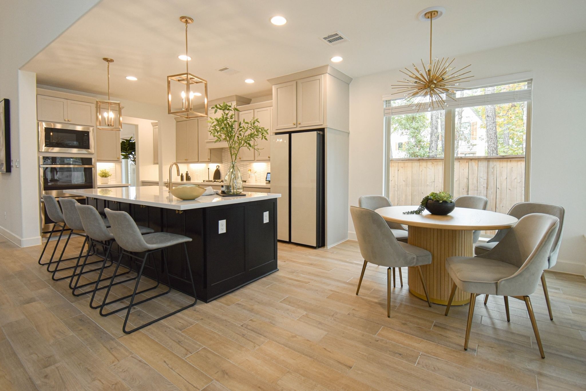 176 Sweeping Valley Drive Montgomery, TX 77316 - Photo 5 of 50 a dining room with furniture a chandelier and wooden floor