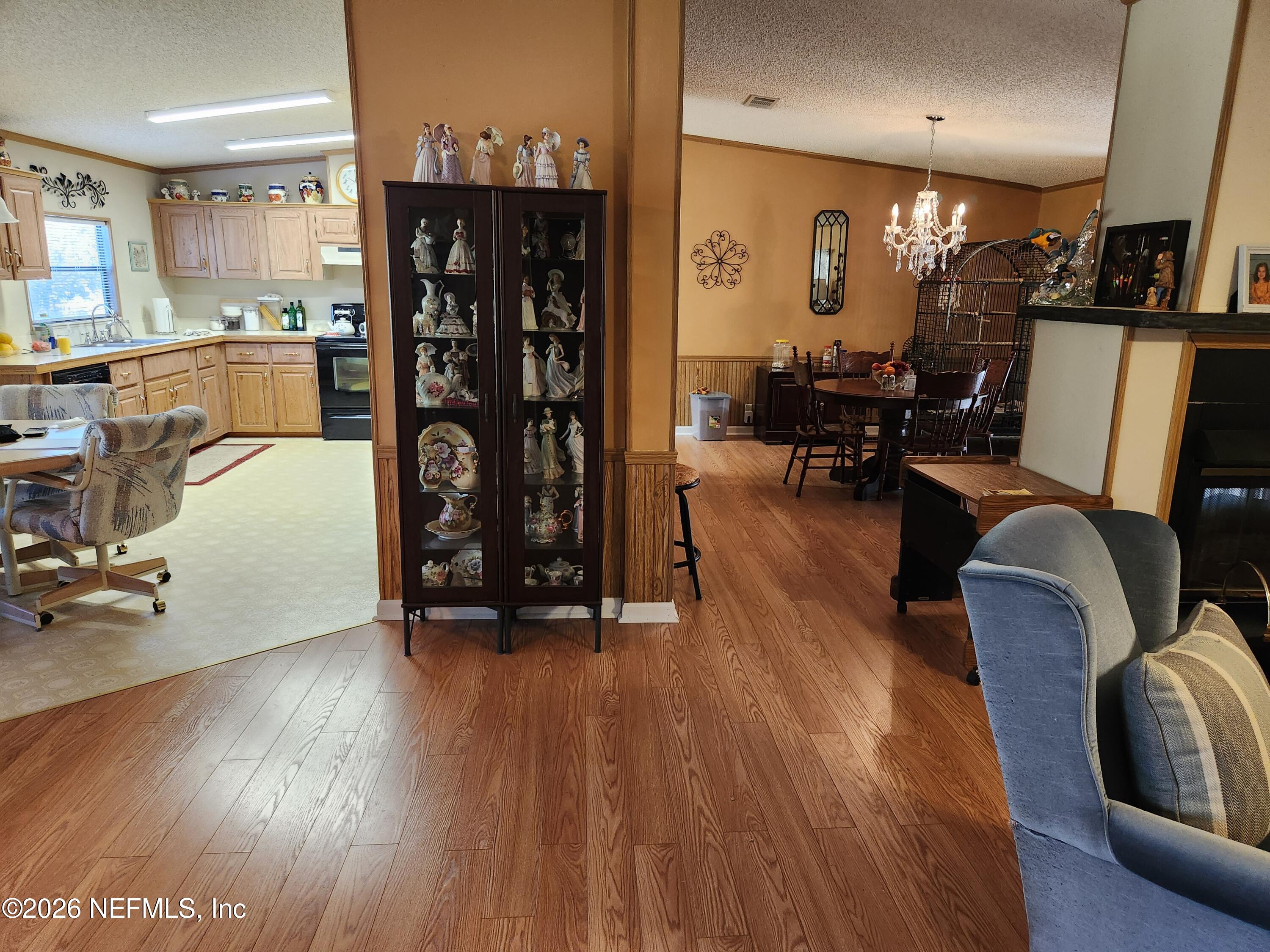 6863 Deer Springs Road Keystone Heights, FL 32656 - Photo 11 of 20 a view of a livingroom with furniture and a gym equipment