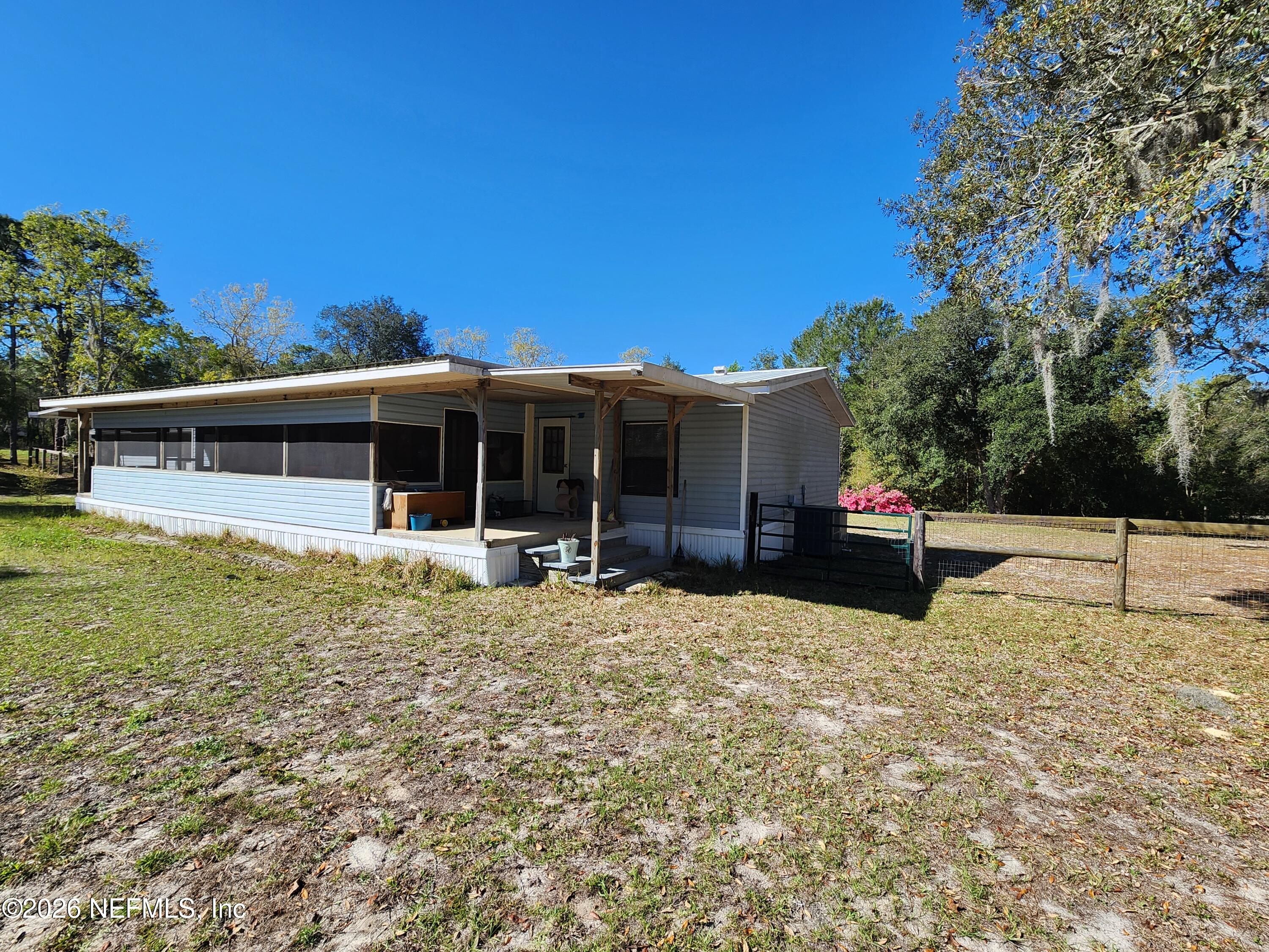 6863 Deer Springs Road Keystone Heights, FL 32656 - Photo 3 of 20 a house view with a garden space