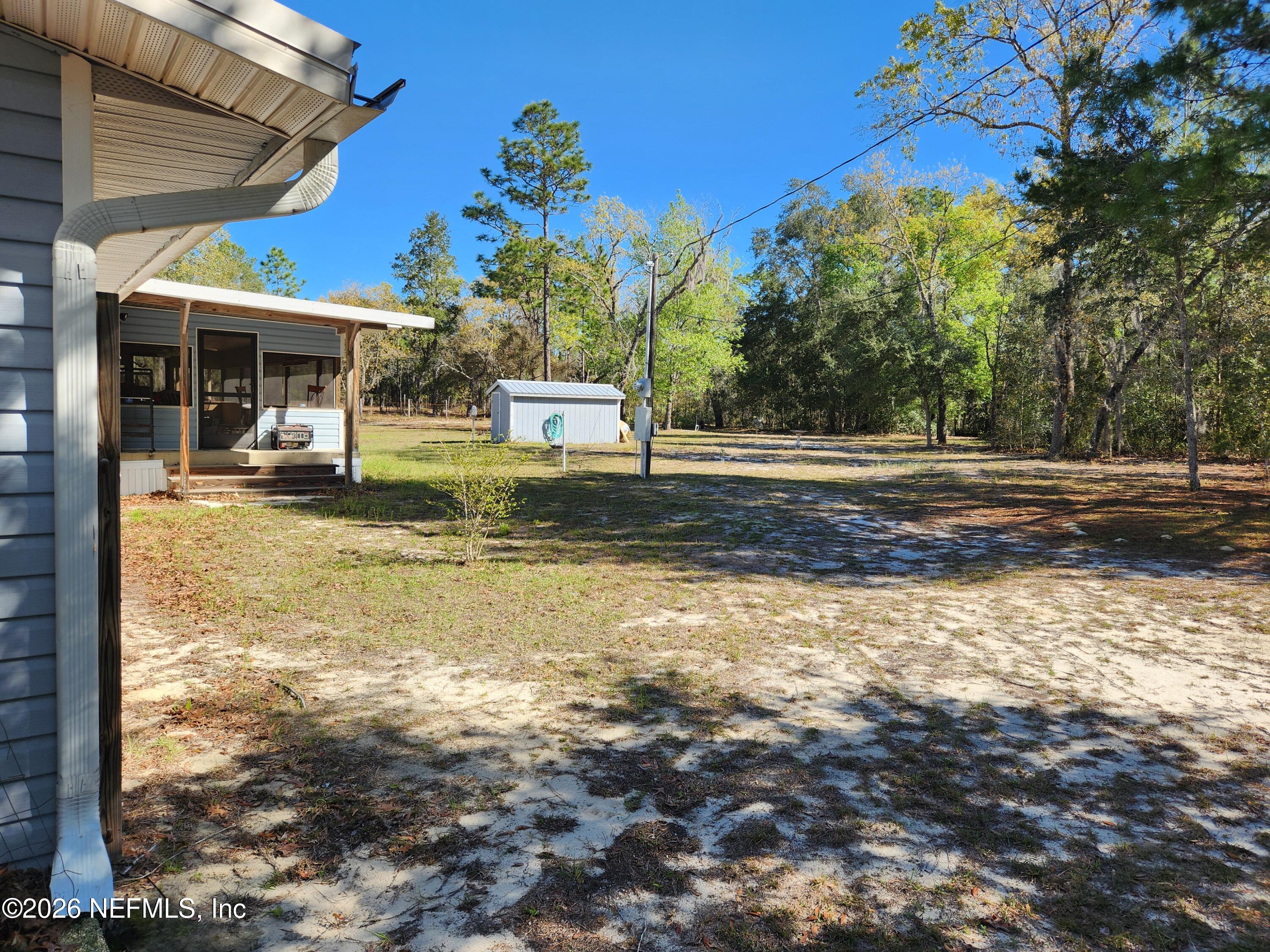 6863 Deer Springs Road Keystone Heights, FL 32656 - Photo 5 of 20 a view of a house with backyard and sitting area
