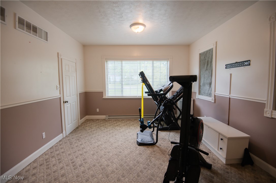 4594 Center Road Andover, OH 44003 - Photo 27 of 39 Exercise room featuring carpet and a textured ceiling. 4th bedroom