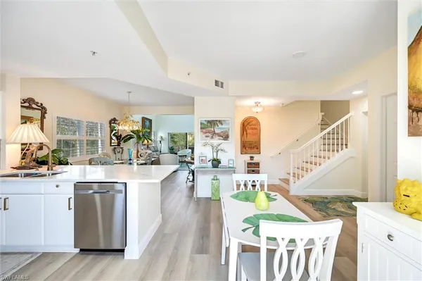 a kitchen with lots of counter top space and wooden floor