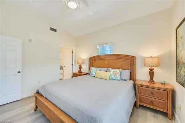 a bedroom with furniture and a wooden floor