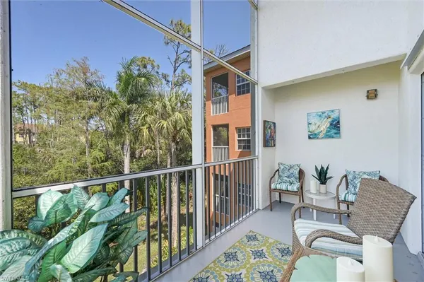 a view of balcony with furniture