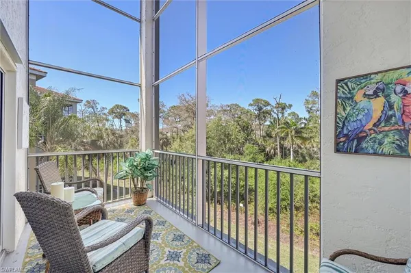 a view of a balcony with furniture