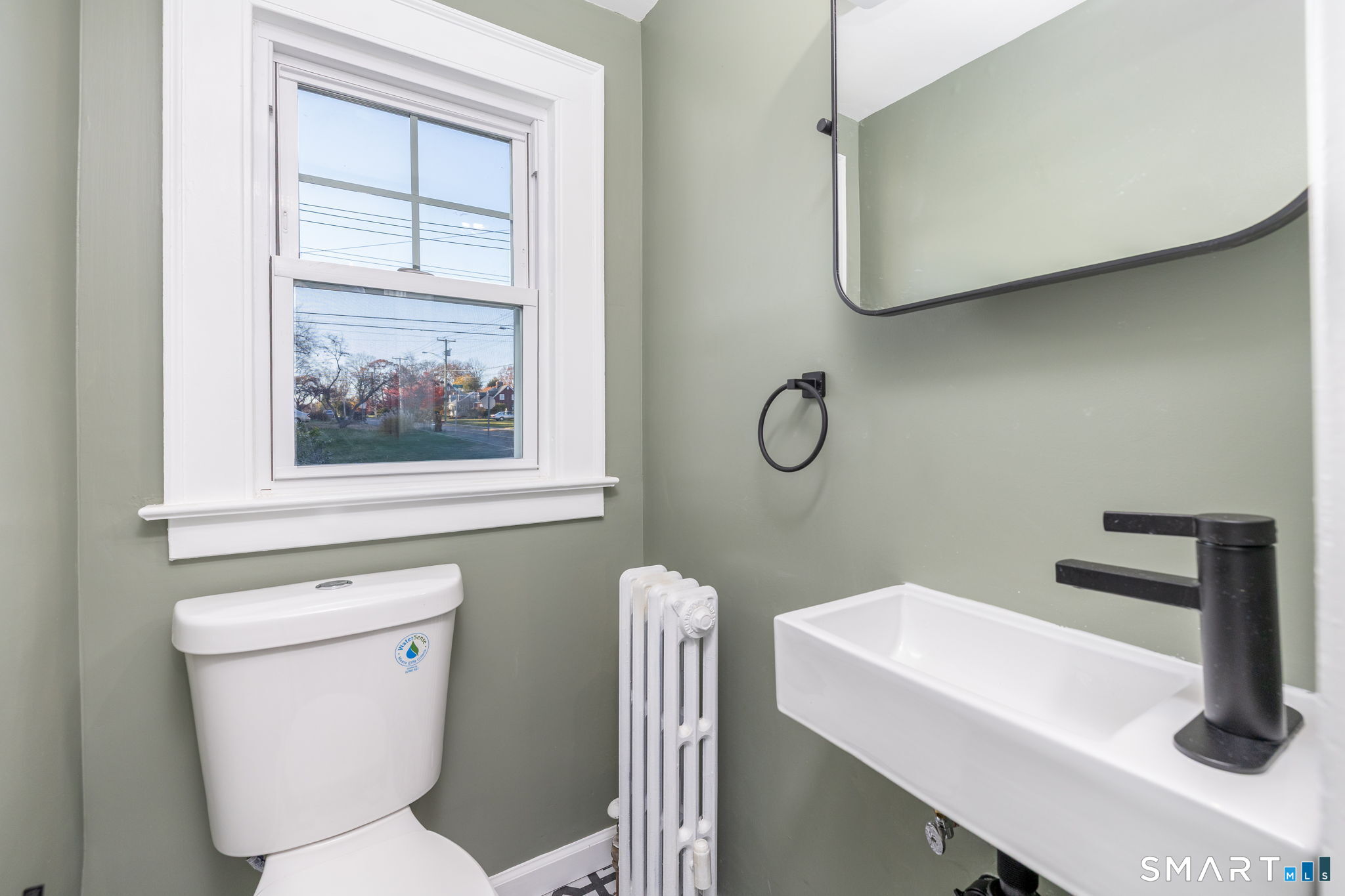 51 Hepburn Road Hamden, CT 06517 - Photo 15 of 40 a bathroom with a toilet a sink and mirror