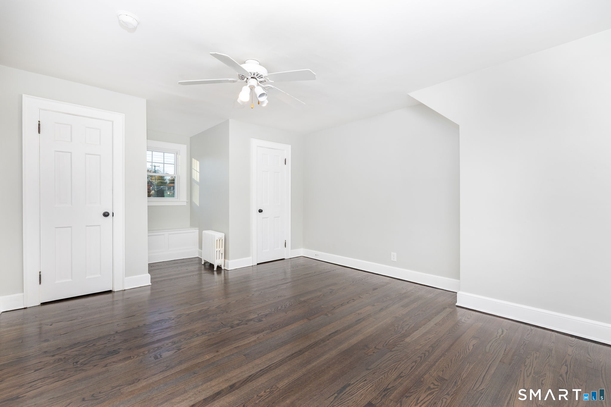 51 Hepburn Road Hamden, CT 06517 - Photo 18 of 40 a view of an empty room with wooden floor