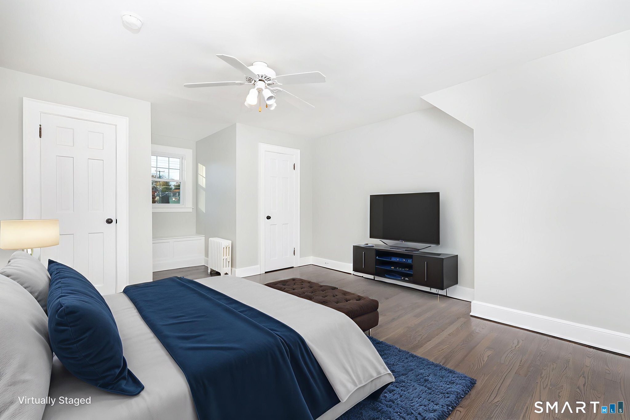 51 Hepburn Road Hamden, CT 06517 - Photo 19 of 40 a bedroom with a bed and a flat screen tv