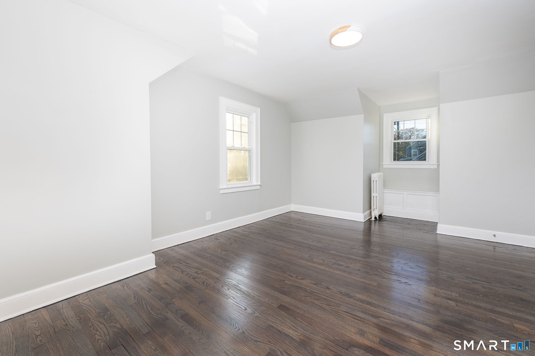51 Hepburn Road Hamden, CT 06517 - Photo 23 of 40 an empty room with wooden floor and windows