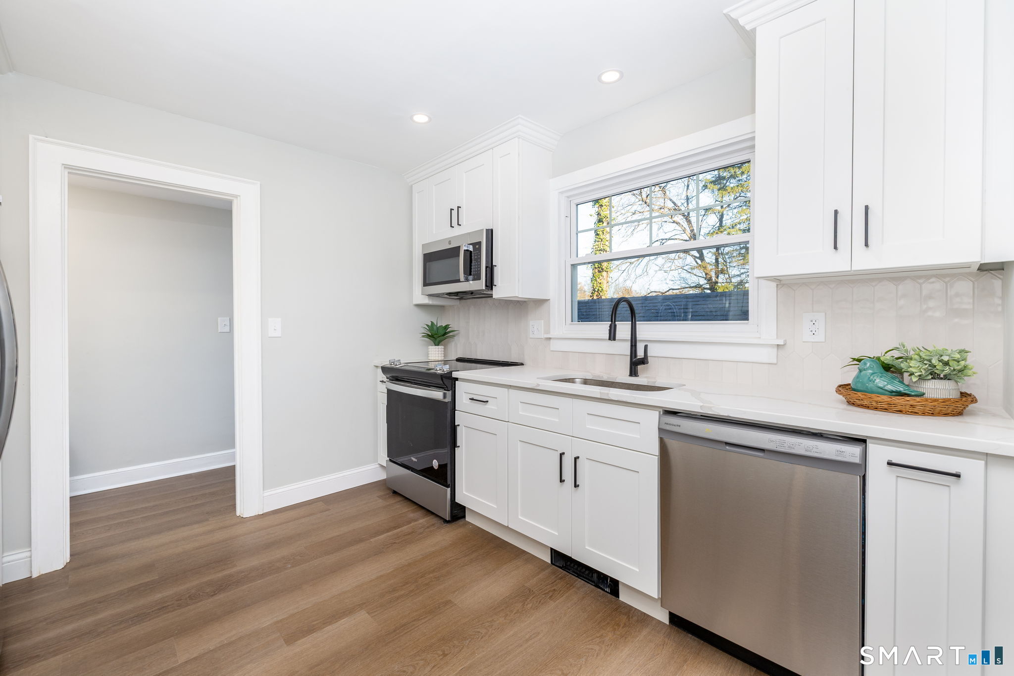 51 Hepburn Road Hamden, CT 06517 - Photo 3 of 40 a kitchen with a sink cabinets and window