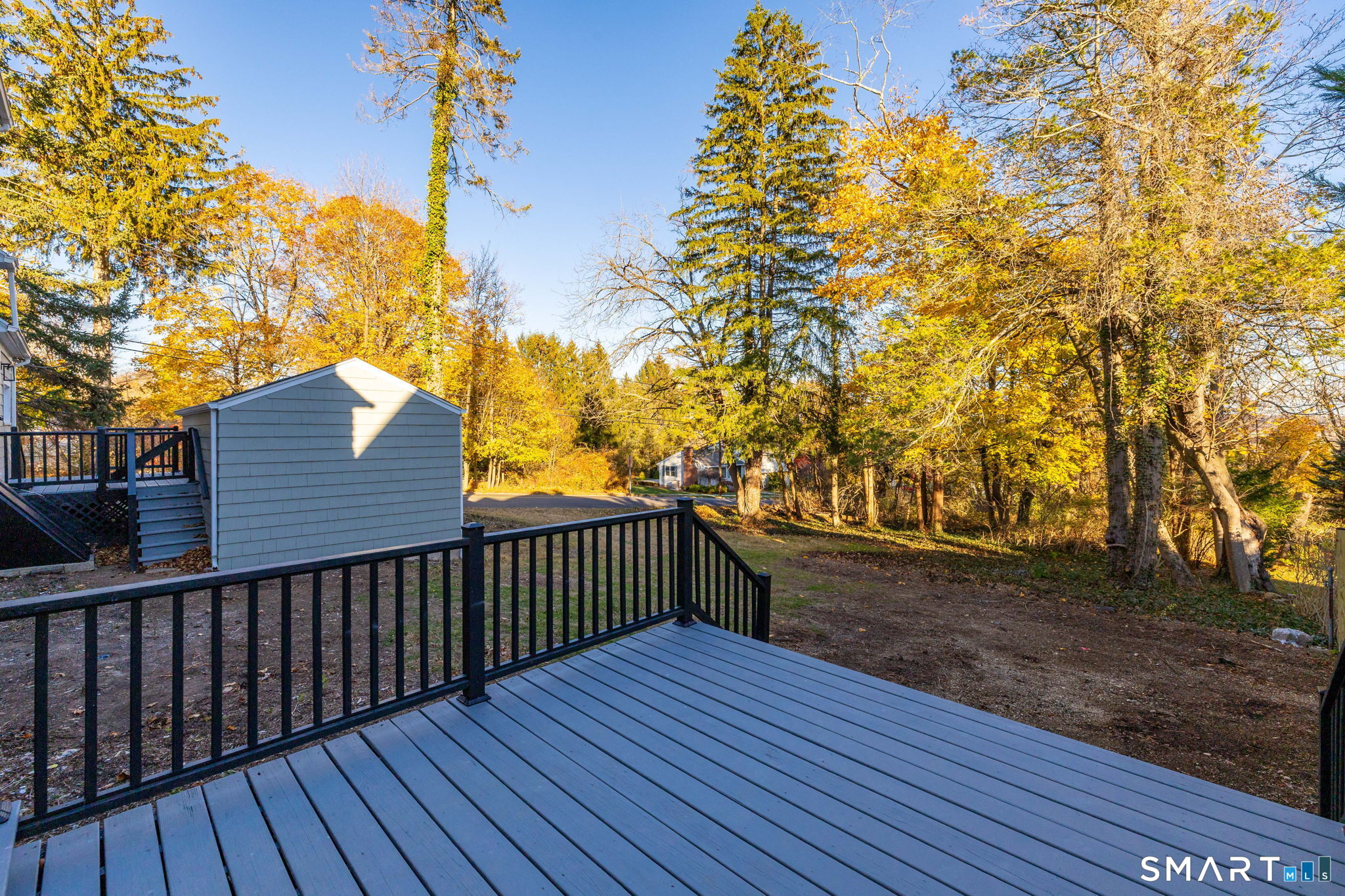 51 Hepburn Road Hamden, CT 06517 - Photo 36 of 40 a view of a backyard with wooden fence