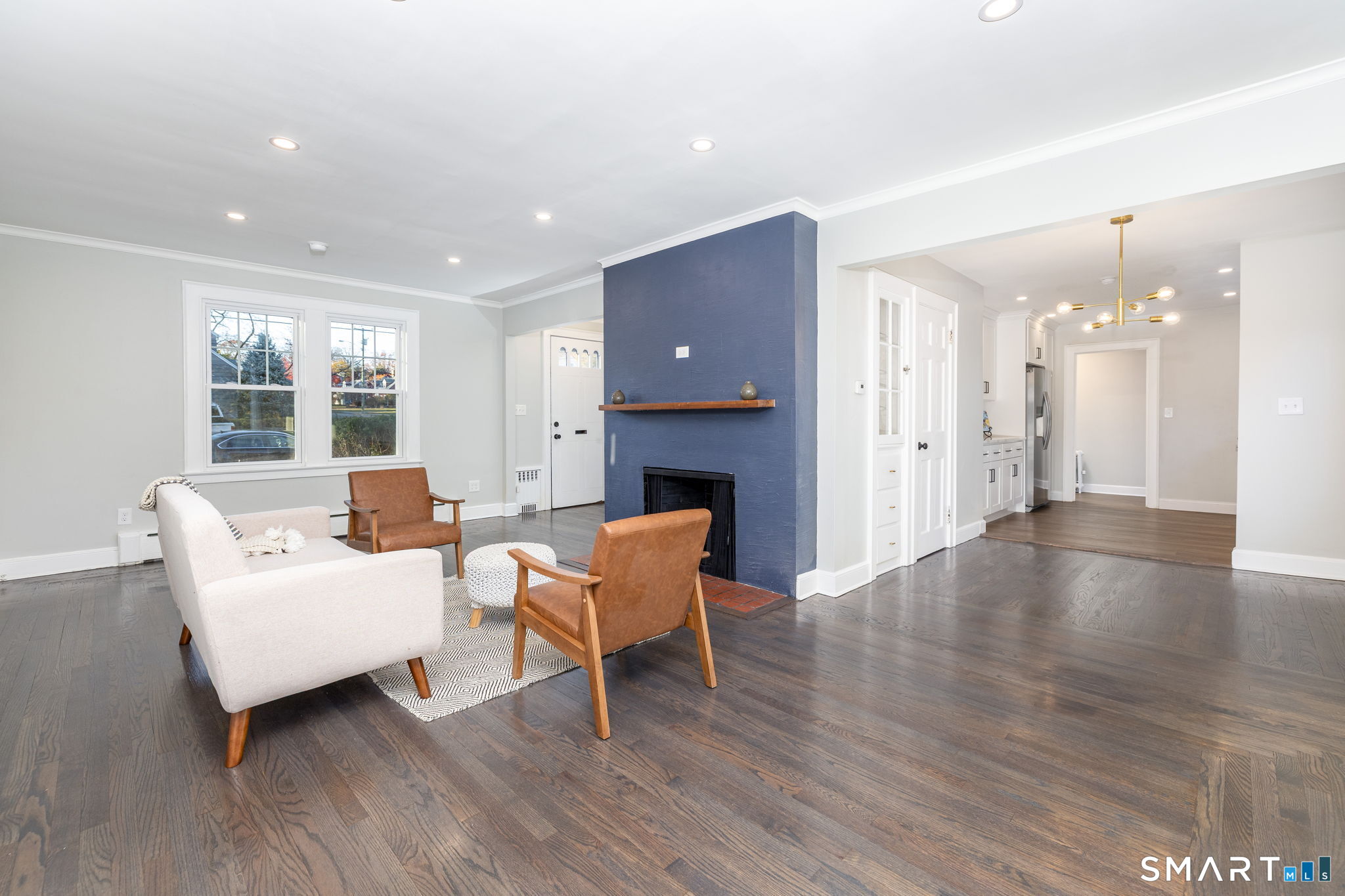51 Hepburn Road Hamden, CT 06517 - Photo 7 of 40 a living room with furniture and a fireplace