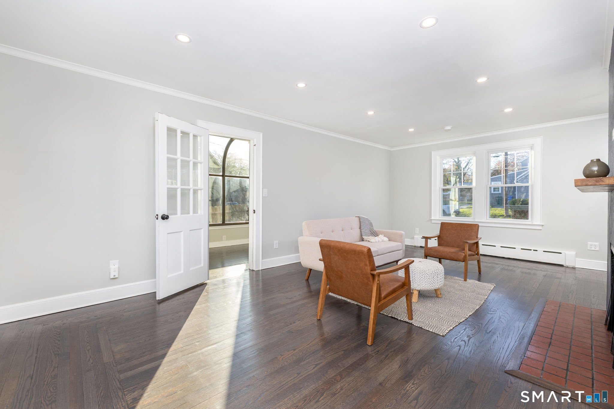 51 Hepburn Road Hamden, CT 06517 - Photo 9 of 40 a dining room with wooden floor and a floor to ceiling window