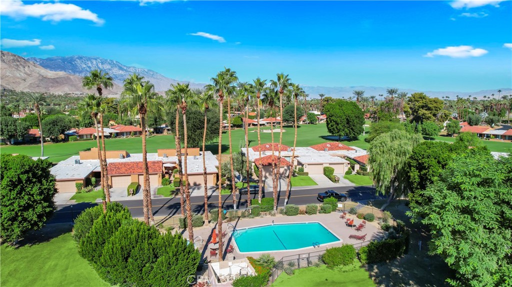 48 Palma Drive Rancho Mirage, CA 92270 - Photo 1 of 32 an outdoor space with seating area and trees in the background