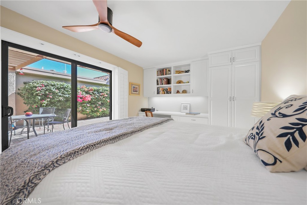 48 Palma Drive Rancho Mirage, CA 92270 - Photo 18 of 32 a bedroom with furniture and a large window