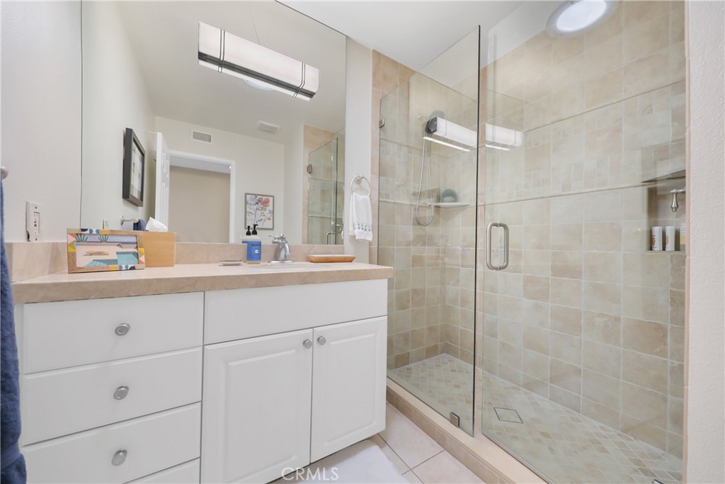48 Palma Drive Rancho Mirage, CA 92270 - Photo 19 of 32 a bathroom with a shower sink and mirror