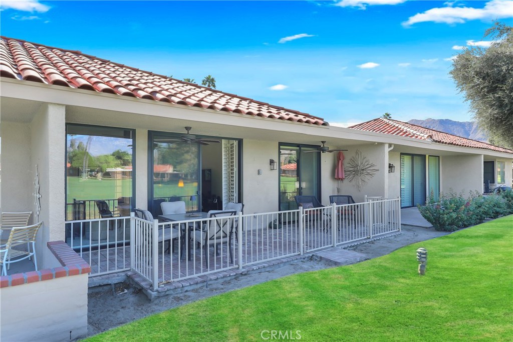 48 Palma Drive Rancho Mirage, CA 92270 - Photo 24 of 32 a view of a house with a yard and porch