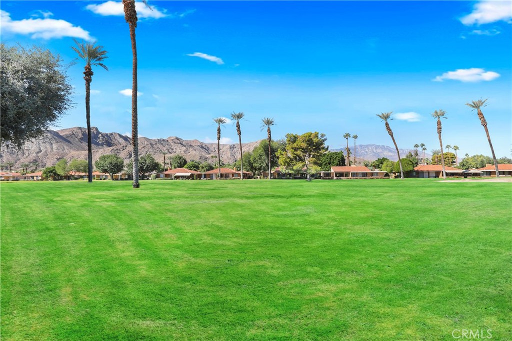 48 Palma Drive Rancho Mirage, CA 92270 - Photo 25 of 32 a view of a building with a big yard
