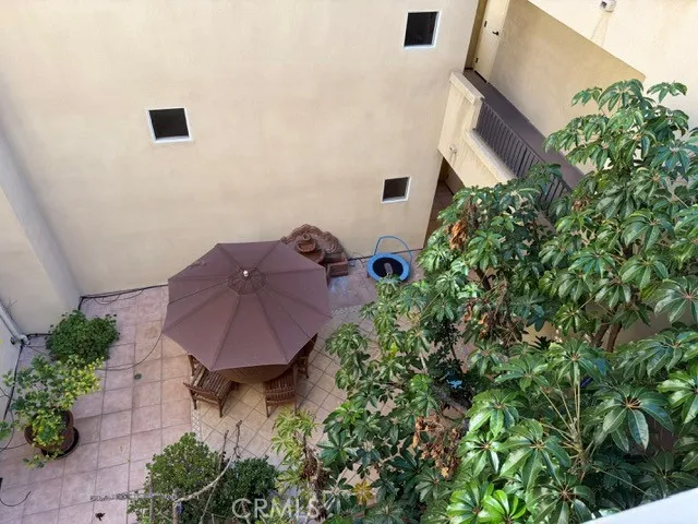 view of a house with a yard and garden