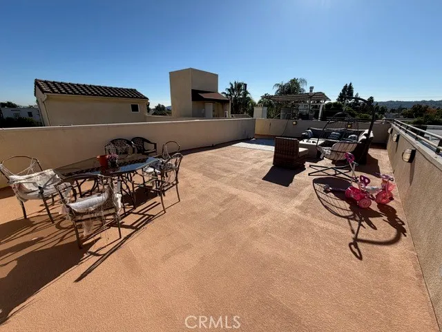 a bedroom with furniture and a flat screen tv