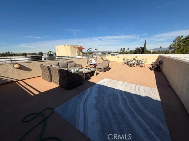 a view of a terrace with seating area