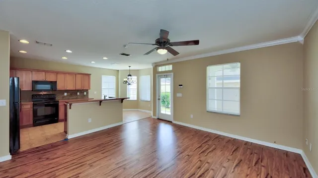 a view of kitchen with stove and wooden floor