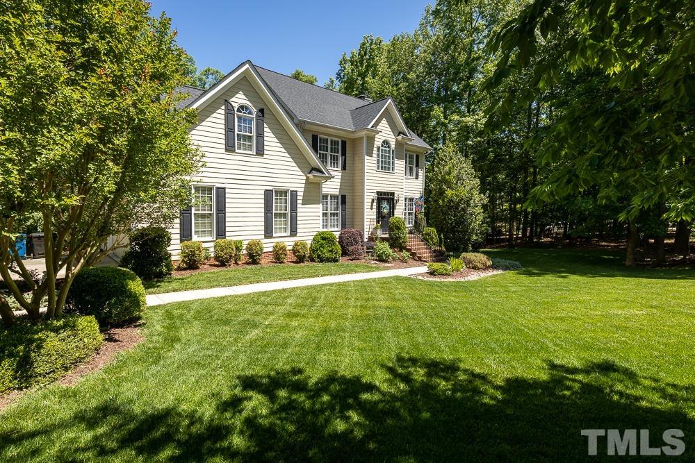 12625 Amoretto Way Raleigh, NC 27613 - Photo 41 of 42 a front view of house with yard and green space