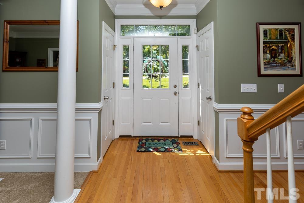 12625 Amoretto Way Raleigh, NC 27613 - Photo 5 of 42 a view of an entryway with wooden floor and windows