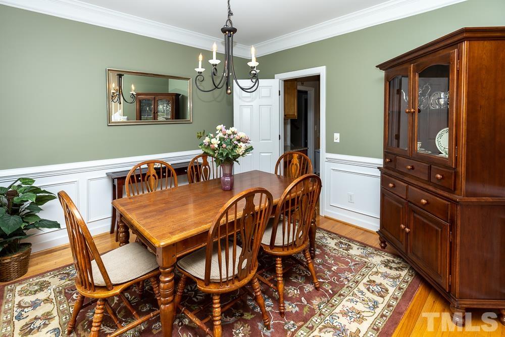 12625 Amoretto Way Raleigh, NC 27613 - Photo 6 of 42 a dining room with furniture and window