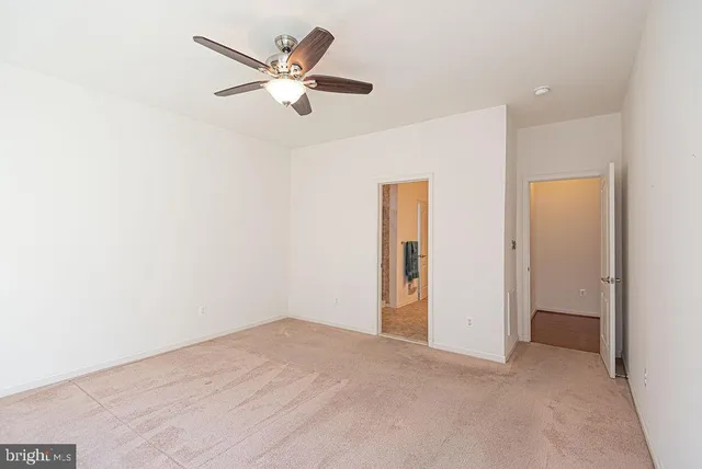 a bathroom with a granite countertop shower mirror and a sink