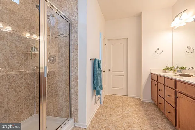 a bathroom with a double vanity sink and mirror