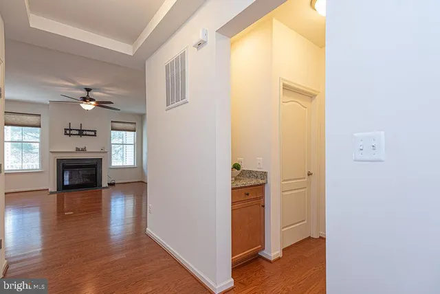 a view of a chair and table in backyard of the house